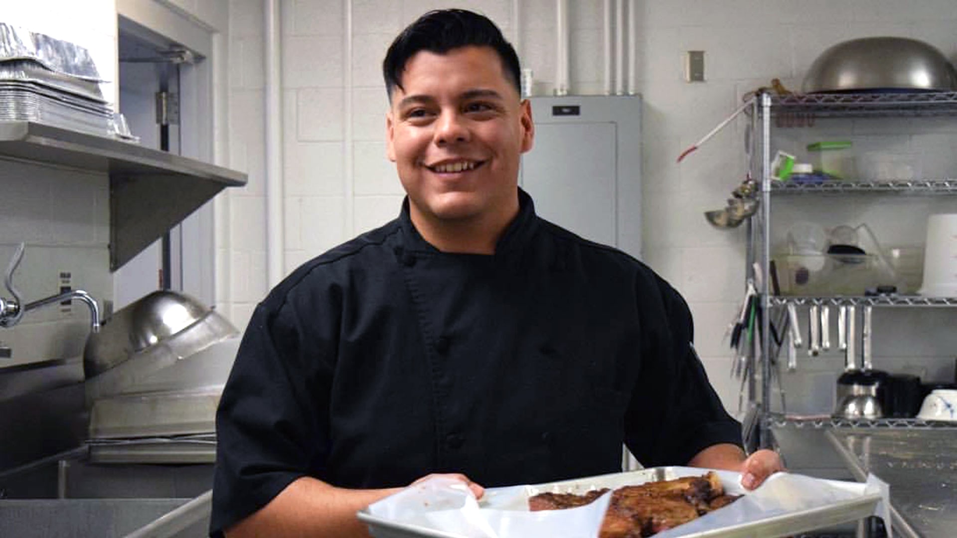 David Villanueva '17 cooking in the kitchen